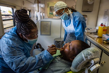Nontsolo Losie (28) has a tooth removed by medical staff in the dental dapertment of the Phelophepa healthcare train. The train has been providing primary health services to remote and under-resourced...