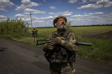 Ukrainian soldiers keep watch for Russian drones near the village of Zelene Pole.