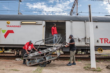 Workers from the Phelophepa healthcare train pack away chairs and other equipment as the train prepares to depart from Kroonstad to Thaba Nchu. The Phelophepa train has been providing primary health s...