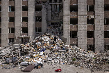 A man salvaging items from a destroyed apartment complex, that was hit by a Russian airstrike on 13 March 2022 with six people dying in the attack.