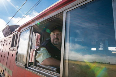 Train driver Andre Van Wyk (50), in the cabin of the Phelophepa healthcare train on the line from Kroonstad to Hennenman. Van Wyk, who has been driving trains for over five years, says the theft of ca...