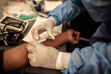 A patient undergoing cancer screening at the Phelophepa healthcare train, has a blood sample drawn by a medical worker. The train has been providing primary health services to remote and under-resourc...