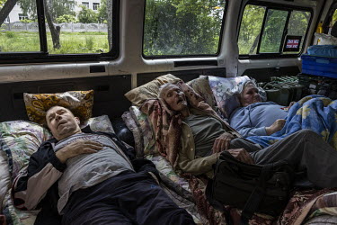 Elderly and sick evacuees from the city of Bakhmut lie in the back of a minivan during an evacuation mission run by Vostok-SOS. As Russian forces continue their offensive in eastern Ukraine, a range o...