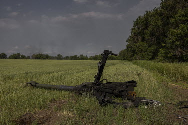 A destroyed American made M777 Howitzer lies in a field outside the city of Lysychansk.