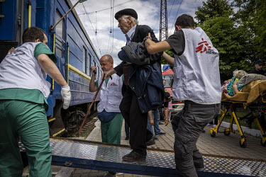 Elderly and sick civilians, along with their children and carers, board an MSF run medical evacuation train in Pokrovsk.