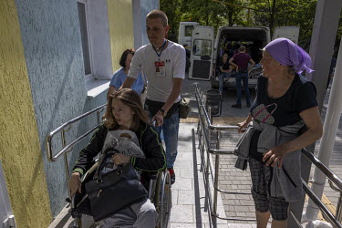 Maria Alefirenko (31),Â�who was injured in a mortar attack during the war in eastern Ukraine in 2014, arrives at a hospital in Sloviansk where evacuees were to stay overnight before being sent furthe...