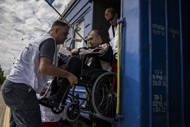 Elderly and sick civilians, along with their children and carers, board an MSF run medical evacuation train in Pokrovsk.
