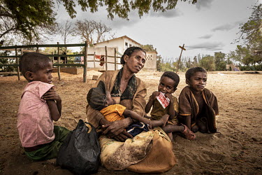 A woman with her malnourished children.