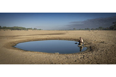 A water hole dug in the dry Manambovo riverbed.