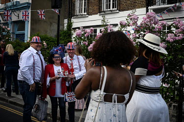 People enjoy a Platinum Jubilee street party commemorating 70 years on the throne for HRH Queen Elizabeth II.