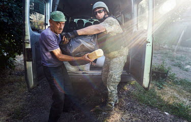 Loaves of bread and drinking water being distributed to residents of Pavlovka which was liberated from Russian forces a week earlier. Pavlovka was occupied by Russian forces from 22 March to 23 June 2...