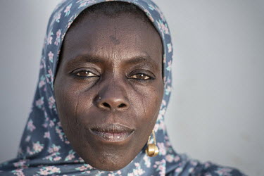 An IDP woman living in the 'Dar es Salaam' refugee camp, meaning 'place of peace', a tent city in the desert home to many who have suffered at the hands of Boko Haram.  Lake Chad, which spanned 9,652...