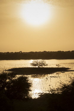 The sun sets over Lake Chad.  Lake Chad, which spanned 9,652sqm in 1963, has shrunk by 90 per cent in recent decades. Climate change is to blame, with population growth and unplanned irrigation also c...