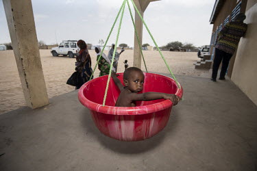 A malnourished childr is weighed and measured at the WFP nutrition clinic in the Dar es Salaam Refugee camp.  Lake Chad, which spanned 9,652sqm in 1963, has shrunk by 90 per cent in recent decades. Cl...