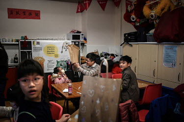 Families take part in a creative workshop designed to help with mental health needs during the Spring Fun Festival at the Islington Chinese Association. The festival is helping Hong Kongers socialise...