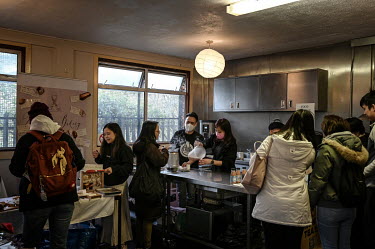 Eric and Ann Wong (centre) serve their homemade milk tea to customers attending a Spring Fun Festival. The event, at the Islington Chinese Association, helped Hong Kongers socialise after arriving in...