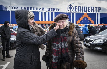 Ludmilla Rodichkina (84), with daughter Natalia. Refugees from Mauriupol arrive at a makeshift reception centre in a Zaporizhzhia supermarket car park.