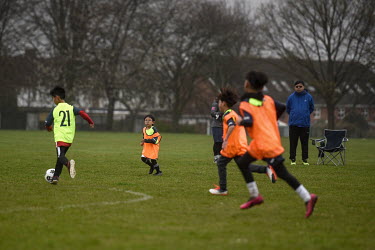 A group of children from Hong Kong take part in a weekly football match set up by their parents to help the children make new friends after the families moved to the UK on British National Overseas vi...