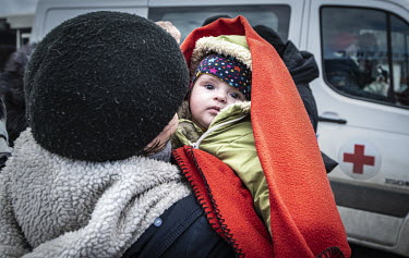 Refugees from Mauriupol arrive in Zaporizhzhia where they are processed at a makeshift reception centre.