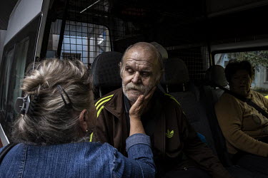Oleksandr Evtushenko (68) says goodbye to his sister Valentyna before being evacuated from a hospital in Sloviansk.