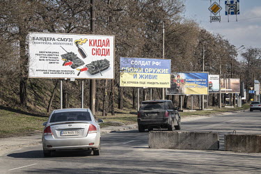 Instructions on the use of Molotov Cocktails to attack Russian tanks displayed on a roadside billboard.