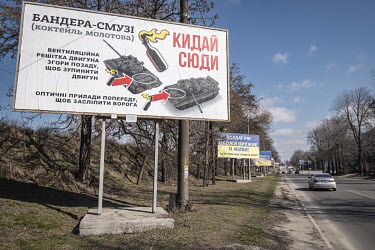 Instructions on the use of Molotov Cocktails to attack Russian tanks displayed on a roadside billboard.