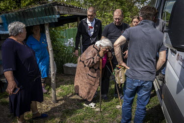 A group of volunteers from the UK and Ukraine, help an elderly woman board an evacuation bus near Bakhmut. With Russian forces less than 10 miles from the city, more people are deciding to leave for f...