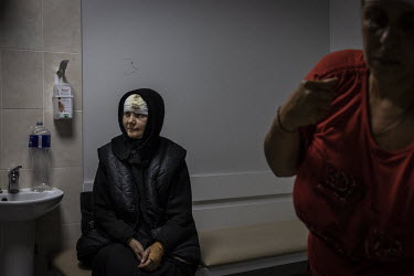 Ioanna, a nun from Sviatohirsk monastery, who was injured the day before by Russian shelling, waits at a hospital in Sloviansk after receiving treatment. She said that one priest was killed in the att...