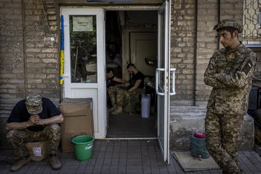 Ukrainian soldiers are examined for injuries and ailments at an aid station in the city of Bakhmut. After 100 days of war, and the fighting becoming increasingly brutal on the frontlines, medics talk...