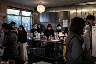 Eric and Ann Wong (centre) serve their homemade milk tea to customers attending a Spring Fun Festival. The event, at the Islington Chinese Association, helped Hong Kongers socialise after arriving in...