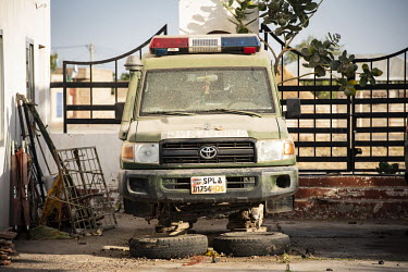 An abandoned and broken ambulance at the Military Hospital.