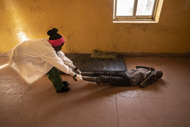 A mentally ill man, abandoned by his family, is dragged by a member of staff back onto an excrement and urine soaked mattress at the Military hospital in Renk. Even the most basic needs are not met, h...