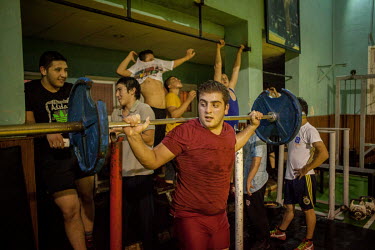 Emin Kilic, in red, during a training session for oil wrestlers in one of Istanbul's oldest and most well renowned clubs, the Haydarpasa Demirspor Kulbubu.