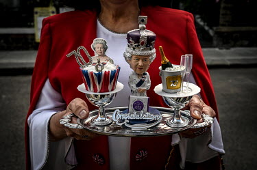 Maria Elenilda Marcal holding a tribute to the Queen, at the Abingdon Platinum Jubilee street party held to commemorate 70 years on the throne for HRH Queen Elizabeth II.