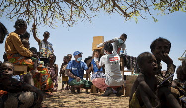 Soatinatae (3) has her height assessed at a MEDAIR mobile nutrition clinic.