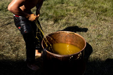 A Turkish oil wrestler begins the process of soaking himself in olive oil prior to competing at the Kirkpinar stadium, near the western border city of Edirne.   The venue hosts the Turkish national sp...