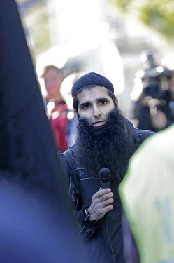 Arfan Qadeer Bhatti, known for his participation in a shooting at a synagogue in Oslo who has also been imprisoned for domestic violence offences, talks to fellow Muslims during a protest outside the...