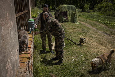 Soldiers with the 93rd Mechanised Brigade of Ukraine's Ground Forces, wash their hands at forward operating base.