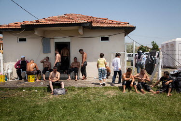 Oil wrestlers prepare their traditional trousers, cover themselves in oil and take showers during a tournament in Silivri.