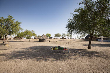 Abuk Myiik (32), who is pregnant, rests on a bed under in the shade of a tree. She has already has seven children.  Since the end of 2013, conflict has cost almost 400,000 lives and left six million p...