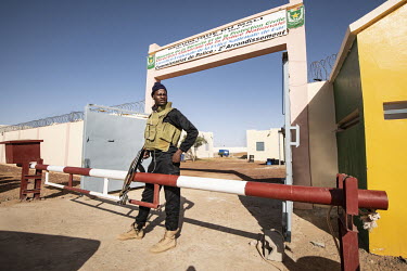 A guard at the entrance to a police base.  In 2012, Islamist radicals linked to al-Qaeda, hijacked an uprising by ethnic Tuareg people and went on to seize cities across northern Mali. As part of an i...