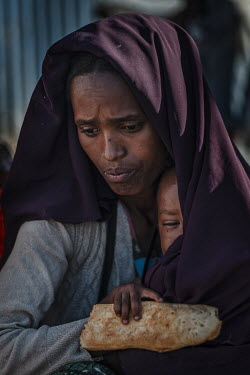 Abdi Kadir, with her baby Ali Bade, who have crossed the border to escape the conflict in Ethiopia.