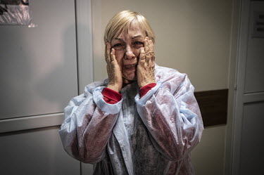 A distressed Valentina Feschenko, the grandmother of Masha Feschenko who has had her leg amputated, at Zaporizhzhia Regional Clinical Children's Hospital.