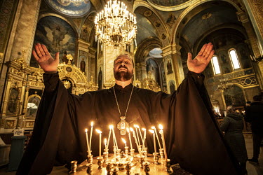 Orthodox priest Archdeacon Dimitryi of the Svyato Uspenskyy Cathedral who says he blames the West for the Russian invasion.