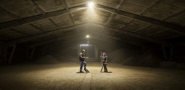 Oleksander Polyuganych and Rosa Golovatyuk in a grain storage facility at the UKRGRAIN farm in the Odessa Oblast.   Ukraine produces almost 12% of the wheat in the global export market.