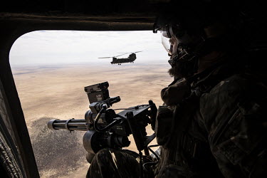 Sgt Stephen operates the door guns in a Chinook during an RAF flight over the desert, part of Operation NEWCOMBE CH47, the codename for British military assistance to France's Operation Barkhane. NEWC...
