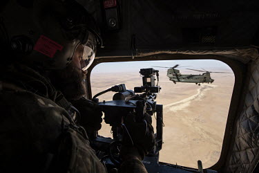 Sgt Stephen operates the door guns in a Chinook during an RAF flight over the desert, part of Operation NEWCOMBE CH47, the codename for British military assistance to France's Operation Barkhane. NEWC...