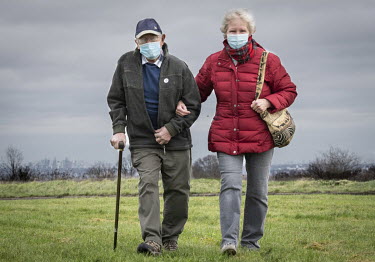 Gordon Osborne (86), who had a COVID-19 vaccination today, and his wife Penny (80) walking on Epsom Downs where a mass vaccination centre has been established at Epsom Racecourse.
