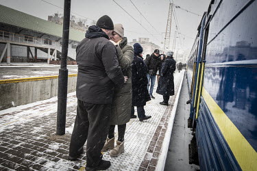 A couple from Mykolayiv say their goodbyes and embrace before boarding a Lviv bound train at Odessa's railway station.