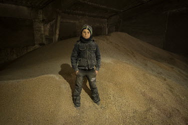 Mykhailo Golovatyuk in a grain storage facility at the UKRGRAIN farm in the Odessa Oblast.   Ukraine produces almost 12% of the wheat in the global export market.